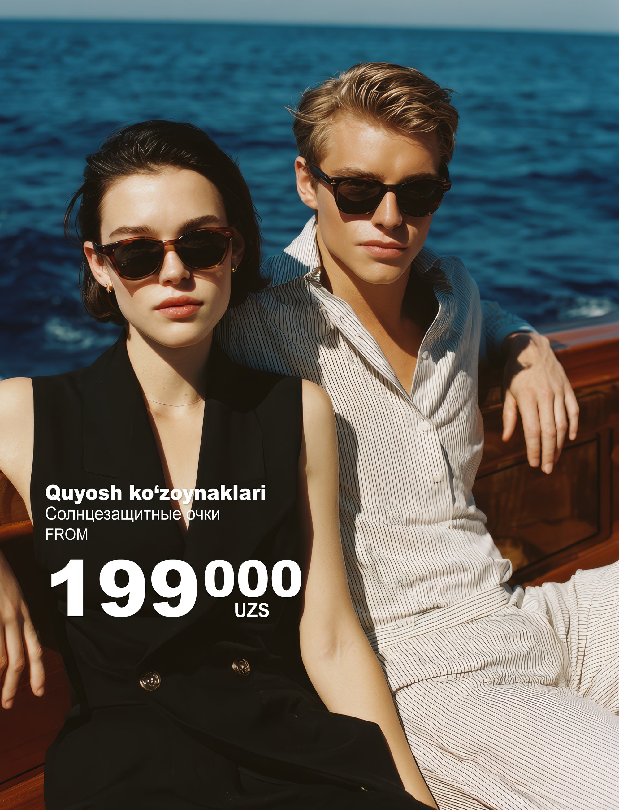 Yaxtada quyosh ko'zoynagi kiygan juftlik